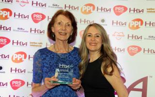 Photograph shows Veronica Ryder, left, receiving her award from Charlotte Smith from PPL