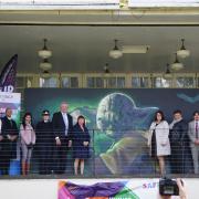 The Lives Before Knives Campaign stood in front of the graffiti artwork