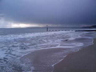 This photo was taken on the beach by Durley Chine 5th Jan 2010, just as the weather clouds were heading over the Purbecks. Taken by Ben Dames.