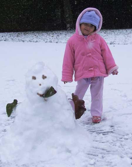 Pictures of Alyssa, our 3 year old daughter in Winton, Bournemouth, with snowman.  Sent in by Mrs Dunsmore. Taken Jan 6, 2010.  