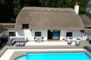 Features of the cottage include a swimming pool, jacuzzi and its own private pub