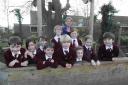 Claire King, head teacher of The Priory School in Christchurch, with some her pupils.