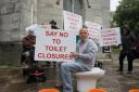 A protest against Borough of Poole closing public toilets