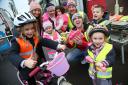 Mike Trimby hands out high vis vests to local children. The latest event was in Christchurch in February.