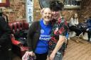 Gloria Colclough, 70, had her head shaved in solidarity with her daughter who is undergoing cancer treatment. Assisting her were hairdresser Tina Desmond-Haskell and former Bond girl Caroline Munro. Picture, Amber Lovell