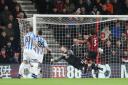 UNSTOPPABLE: Cherries keeper Asmir Begovic is beaten by a header from Huddersfield's Terence Kongolo on Tuesday