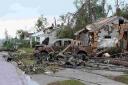 Houses and vehicles are destroyed after a tornado ripped through Tuscaloosa, Alabama last week