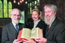 David Crystal, the Rev Sarah Tillett and Gordon Campbell with an original version of the King James Bible