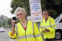 GUNNING FOR SPEEDING MOTORISTS: Volunteers carrying out speed checks