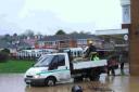 DEEP IMPACT: Council workers help out following the flooding in Southill