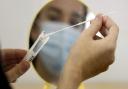 Swab collected for coronavirus test. Picture: PA