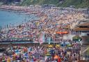 People enjoy the weather on Bournemouth beach in Dorset.  Picture date: Saturday July 17, 2021. PA