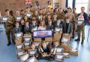 Soldiers and students pack Christmas boxes for kids with overseas parents