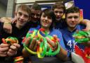 ALL FOR YOU: Sinitija Morgan, centre, and fellow students selling 4 Kyle wristbands at Avonbourne College