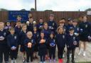 BOWLED OVER: Blandford Bowls Club junior members with their bowls and hoodies, courtesy of Tesco