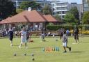 Youngsters learning bowling skills in a fun way