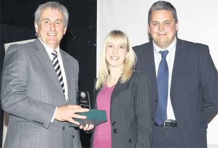 WINNERS: Neal Butterworth,
Editor-in-Chief of the Daily Echo, presents the award for Best Advisors to Gemma Chatfield and James Robinson from Prince Croft Willis.