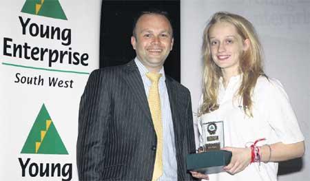 WINNER: Mark Whittam, of the Daily Echo, presents the award for Best Report to Ella Sharpley, managing director of the Fusion team.
