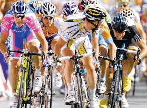 SPRINTING SUCCESS: Cavendish, centre, crossing the line in first place yesterday to win stage 18 of the Tour de France