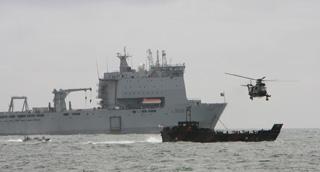 Launch event at Bournemouth Pier -  demonstration by Sea King and Royal Marine Landing craft in front RFA Largs bay