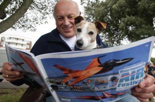 Yes, that's a dog, reading an Air Festival brochure. What of it? Picture: Corin Messer.