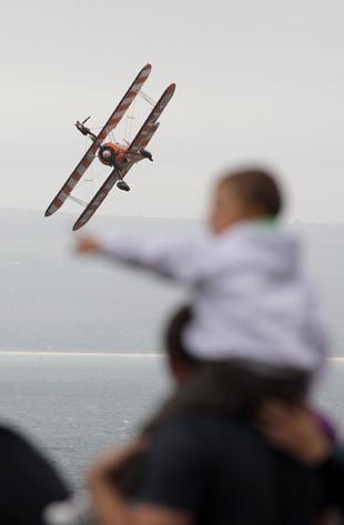 Reaching out for The Breitling Wingwalkers. Picture: Corin Messer.