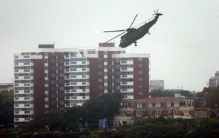 Bournemouth Air Festival Day Three - Day on RFA Largs Bay  -  A Sea King helicopter  flies over Bournemouth beach