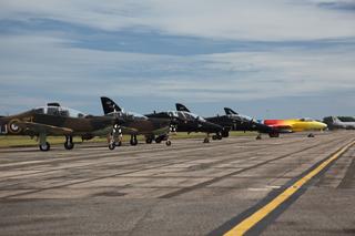 The Battle of Britain Memorial Flight on the tarmac at Bournemouth Airport, with Miss Demeanour in the distance.