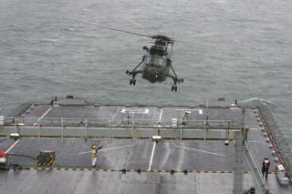 Bournemouth Air Festival Day Three - Day on RFA Largs Bay  -  A Sea King helicopter llifts off from the flight deck