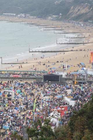 The crowds on the beach at Bournemouth Pier, who braved the poor weather conditions to make the most of the final day.