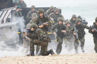 The Royal Marine Beach Assault. Marines exit the landing craft on to the beach. 