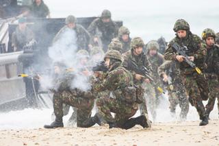 The Royal Marine Beach Assault. Marines exit the landing craft on to the beach and fire at the terrorists.
