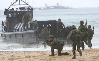 Royal Marines beach assault after terrorists capture some children on the beach.