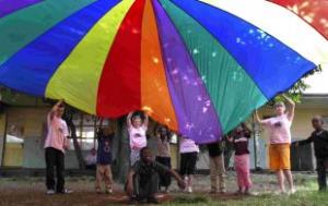 FUN AND GAMES: Parachute games featured regularly during the activity week the students ran for special needs children