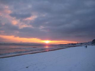 Sunset on a snowy Bournemouth beach. Taken by Beryl Grindrod.