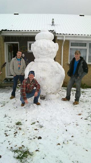 Snowman built in Bingham Road in Verwood. At least 8ft tall. L-R Shaun Harvell , Steve Wentworth  and Matthew Harvell.