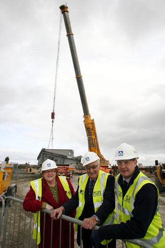The Twin Sail Bridge site in Hamworthy. The site sees the delivery of the first steel parts of the bridge. 9/3/11. R-L: Site Manager Richard Bruten, Cllr Ron Parker and Cllr Elaine Atkinson.