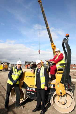 The Twin Sail Bridge site in Hamworthy. The site sees the delivery of the first steel parts of the bridge. 9/3/11. L-R: Site Manager Richard Bruten, Cllr Ron Parker and Cllr Elaine Atkinson.