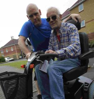 Paul Bellard pictured with Andrew Phillips (on scooter)