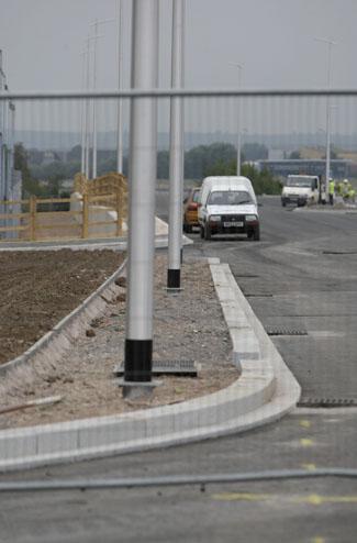 Lamp posts in the middle of pavements on the new Twin Sails Bridge link road, 29.7.11.