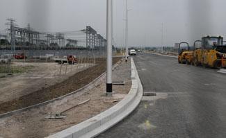 Lamp posts in the middle of pavements on the new Twin Sails Bridge link road, 29.7.11.