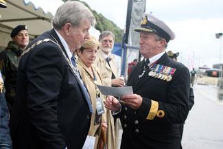The first day of Bournemouth Air Festival sees torrential rainfall as Commodore Jamie Miller and the Mayor and Mayoress of Bournemouth take part in the official launch.