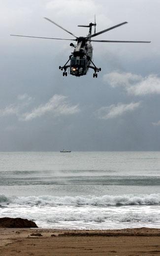 The first day of Bournemouth Air Festival sees torrential rainfall but despite that the Sea King helicopter makes a brief appearance over Bournemouth beach.