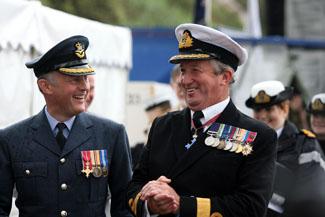 The first day of Bournemouth Air Festival sees torrential rainfall and only a few brave people wander down the sea front for the official launch. Pictured are Group Captain Ian Tolfts (left) and Commodore Jamie Miller.