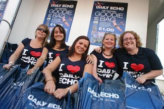 The team of girls selling the  Daily Echo goodie bag  at the Bournemouth Air Festival 2011. Picture by Sally Adams.