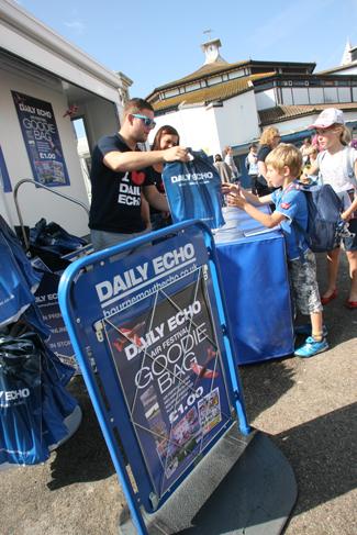 The newspaper sales team selling the Daily Echo goodie bag by the Pier Approach at the Bournemouth Air Festival 2011. Picture by Sally Adams. 