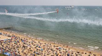 A packed beach enjoys the Breitling Wingwalkers. Picture: Richard Crease.
