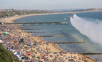 Saturday Flying display. The Breitling Wingwalkers fly along the seafront at Boscombe.