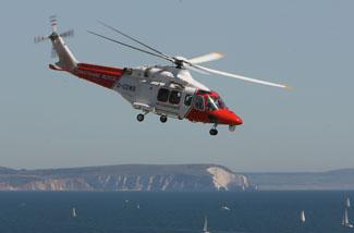 Saturday Flying display. The Coastguard helicopter  Golf Whiskey Bravo takes off  from the beach.