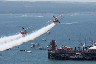 Saturday Flying display. Breitling Wingwalkers over Bournemouth Pier.